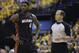 Miami Heat forward LeBron James, left, talks with referee John Goble during the fourth quarter of Game 2 of the NBA basketball Eastern Conference finals against the Indiana Pacers in Indianapolis, Tuesday, May 20, 2014. The Heat defeated the Pacers 87-83 to tie the series at 1-1. (AP Photo/Michael Conroy)