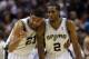 SAN ANTONIO, TX - MAY 29: Tim Duncan #21 and Kawhi Leonard #2 of the San Antonio Spurs talk in the second quarter against the Oklahoma City Thunder during Game Five of the Western Conference Finals of the 2014 NBA Playoffs at AT&T Center on May 29, 2014 in San Antonio, Texas. NOTE TO USER: User expressly acknowledges and agrees that, by downloading and or using this photograph, User is consenting to the terms and conditions of the Getty Images License Agreement. (Photo by Ronald Martinez/Getty Images)