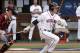 Virginia's Derek Fisher (23) hits the ball during the NCAA regional college game against Elon in Charlottesville, Va., Sunday June 2, 2013. Virginia defeated Elon 11-3. (AP Photo/Andrew Shurtleff)