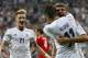 Germany's Miroslav Klose hugs team mate Thomas Mueller after scoring his side's opening goal during their FIFA World Cup 2014 qualification group C soccer match between Germany and Austria in Munich, southern Germany, Friday, Sept. 6, 2013. Left team mate Marco Reus. (AP Photo/Matthias Schrader)
