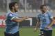 Uruguay´s Luis Suarez, left, celebrates his goal against Peru at a 2014 World Cup qualifying match in Lima, Peru, Friday, Sept. 6, 2013. (AP Photo/Karel Navarro)