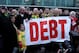 MANCHESTER, ENGLAND - JANUARY 23: Manchester United fans, wearing green and gold scarves, protest against the Glazers, current owners of Manchester United before the Barclays Premier League match between Manchester United and Hull City at Old Trafford on January 23, 2010 in Manchester, England. (Photo by Julian Finney/Getty Images)