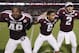 ILE - In this Sept. 21, 2013, file photo, Texas A&M freshman linebacker Darian Claiborne (48), quarterback Johnny Manziel (2) and defensive back Noel Ellis (6) sing the Aggie War Hymm during an NCAA college football game in College Station, Texas. UCLA and Texas A&M each have played 17 true freshmen this season, tied for most among the programs at the highest level of the game. An Associated Press analysis of depth charts and game reports for the 72 BCS-conference teams and Notre Dame this week showed that 359 freshmen were listed as first- or second-stringers, not including special teams. That represented almost 12 percent of the total of 3,212 players. (AP Photo/Bob Levey)