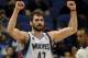 Minnesota Timberwolves forward Kevin Love (42) celebrates in an NBA basketball game against the San Antonio Spurs at the Target Center on in Minneapolis on Tuesday, April 8, 2014. (AP Photo/Hannah Foslien)