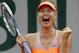 Russia's Maria Sharapova reacts as she defeats Spain's Garbine Muguruza during their quarterfinal match of the French Open tennis tournament at the Roland Garros stadium, in Paris, France, Tuesday, June 3, 2014. Sharapova won 1-6, 7-5, 6-1. (AP Photo/Michel Euler)