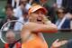 Russia's Maria Sharapova returns the ball to Spain's Garbine Muguruza during their quarterfinal match of the French Open tennis tournament at the Roland Garros stadium, in Paris, France, Tuesday, June 3, 2014. (AP Photo/Michel Euler)
