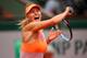 PARIS, FRANCE - JUNE 03: Maria Sharapova of Russia returns a shot during her women's singles quarter-final match against Garbine Muguruza of Spain on day ten of the French Open at Roland Garros on June 3, 2014 in Paris, France. (Photo by Clive Brunskill/Getty Images)