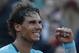 Spain's Rafael Nadal celebrates winning the quarterfinal match of the French Open tennis tournament against compatriot David Ferrer at the Roland Garros stadium, in Paris, France, Wednesday, June 4, 2014. Nadal won in four sets 4-6, 6-4, 6-0, 6-1. (AP Photo/Michel Euler)