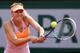 PARIS, FRANCE - JUNE 05: Maria Sharapova of Russia returns a shot during her women's singles semi-final match against Eugenie Bouchard of Canada on day twelve of the French Open at Roland Garros on June 5, 2014 in Paris, France. (Photo by Matthew Stockman/Getty Images)