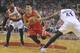 Houston Rockets' Jeremy Lin (7) drives against Portland Trail Blazers' Thomas Robinson (41) and Mo Williams (25) during the first half of game six of an NBA basketball first-round playoff series game in Portland, Ore., Friday May 2, 2014. (AP Photo/Greg Wahl-Stephens)