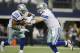 Dallas Cowboys quarterback Tony Romo (9) hands the ball to running back DeMarco Murray (29) during the first half or an NFL football game against the Green Bay Packers, Sunday, Dec. 15, 2013, in Arlington, Texas. (AP Photo/Tony Gutierrez)