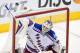 New York Rangers goalie Henrik Lundqvist, of Sweden, top, blocks by the Los Angeles Kings during the third period in Game 1 of the NHL hockey Stanley Cup Finals, Wednesday, June 4, 2014, in Los Angeles. (AP Photo/Mark J. Terrill)