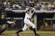 New York Yankees pinch hitter Ichiro Suzuki hits an eighth-inning fly out to left field with Jacoby Ellsbury at third base for the third out in the Yankees 5-2 loss to the Oakland Athletics in a baseball game at Yankee Stadium in New York, Tuesday, June 3, 2014. (AP Photo/Kathy Willens)