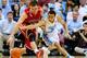 CHAPEL HILL, NC - DECEMBER 21: Tom Droney #23 of the Davidson Wildcats battles for a loose ball with Marcus Paige #5 of the North Carolina Tar Heels during a game at the Dean Smith Center on December 21, 2013 in Chapel Hill, North Carolina. North Carolina won 97-85 in overtime. (Photo by Grant Halverson/Getty Images)