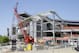 A workman leaves the job site at FirstEnergy Stadium in Cleveland where renovation of the 15-year-old home of the Cleveland Browns continues Thursday, June 5, 2014. Cuyahoga County Executive Ed FitzGerald has suggested divvying up maintenance money from the county's