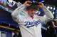 SECAUCUS, NJ - JUNE 5: Grant Holmes puts on his Los Angeles Dodgers cap after being selected 22nd overall during the MLB First-Year Player Draft at the MLB Network Studio on June 5, 2014 in Secacucus, New Jersey. (Photo by Rich Schultz/Getty Images)
