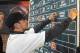 Shortstop Michael Chavis from Sprayberry Senior High School in Marietta, Georgia, posts his name on the board at the 2014 MLB baseball draft Thursday, June 5, 2014, in Secaucus, N.J. Chavis was selected by the Boston Red Sox with the 26th pick in the first round. (AP Photo/Bill Kostroun)