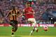 LONDON, ENGLAND - MAY 17: Laurent Koscielny of Arsenal clears the ball from Sone Aluko of Hull City during the FA Cup with Budweiser Final match between Arsenal and Hull City at Wembley Stadium on May 17, 2014 in London, England. (Photo by Shaun Botterill/Getty Images)