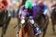 BALTIMORE, MD - MAY 17: California Chrome #3, ridden by Victor Espinoza, races accross the finishline to win the 139th running of the Preakness Stakes at Pimlico Race Course on May 17, 2014 in Baltimore, Maryland. (Photo by Matthew Stockman/Getty Images)