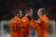 Three offense players Rafael van der Vaart, left, Robin van Persie, center, and Arjen Robben, right, of The Netherlands celebrate after van Persie scored 2-0 during the Group D world cup qualifying soccer match Netherlands against Estonia at ArenA stadium in Amsterdam, Netherlands, Friday March 22, 2013. (AP Photo/Peter Dejong)