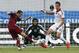 Russia's Alexander Kerzhakov, left, shoots as Morocco's Zouhair Feddal, right, tries to block during a friendly soccer match in Moscow, Russia, Friday, June 6, 2014. Russia won 2-0. This is the last friendly match before the Russian team leaves for Brazil to compete in the World Cup. (AP Photo/\Name\)