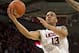 DALLAS, TX - JANUARY 4: Shabazz Napier #13 of the Connecticut Huskies drives to the basket against the SMU Mustangs on January 4, 2014 at Moody Coliseum in Dallas, Texas. (Photo by Cooper Neill/Getty Images)