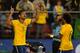 Fred celebrates his match-winning goal with Marcelo.
