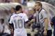 In this photo taken Tuesday, Sept. 10, 2013, United States manager Jurgen Klinsmann, right, talks with Landon Donovan during a World Cup qualifying soccer match against Mexico in Columbus, Ohio. The United States clinched its seventh straight World Cup appearance, getting second-half goals from Eddie Johnson and Donovan on Tuesday night in a 2-0 win over Mexico.(AP Photo/Jay LaPrete)
