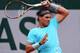 PARIS, FRANCE - MAY 26: Rafael Nadal of Spain returns a shot during his men's singles match against Robby Ginepri of the United States on day two of the French Open at Roland Garros on May 26, 2014 in Paris, France. (Photo by Matthias Hangst/Getty Images)
