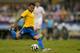 SAO PAULO, BRAZIL - JUNE 06: Daniel Alves of Brazil kicks the ball during the International Friendly Match between Brazil and Serbia at Morumbi Stadium on June 06, 2014 in Sao Paulo, Brazil. (Photo by Buda Mendes/Getty Images)