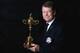 AUCHTERARDER, SCOTLAND - SEPTEMBER 24: Tom Watson, the American Ryder Cup team captain, poses with the trophy during a studio shoot prior to the start of The Ryder Cup Captains' Joint Press Conference at Gleneagles on September 24, 2013 in Auchterarder, Scotland. (Photo by Andrew Redington/Getty Images)