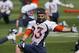 Denver Broncos wide receiver Wes Welker stretches during an NFL football organized team practice at the Broncos training facility in Englewood, Colo., on Wednesday, May 28, 2014. (AP Photo/Ed Andrieski)