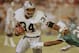 Los Angeles Raiders running back Bo Jackson (34) pushes away Miami Dolphins corner back Tim McKyer (22) during the third quarter of game in Miami's Joe Robbie stadium, Nov. 20, 1990. (AP Photo/Beth Keiser)