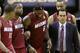 Miami Heat forward LeBron James (6) is helped from the court by guard Mario Chalmers (15), guard Dwyane Wade (3), Erik Spoelstra, front, right, and Rashard Lewis, right rear, during the second half in Game 1 of the NBA basketball finals on Thursday, June 5, 2014 in San Antonio. (AP Photo/Eric Gay)