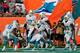 MIAMI GARDENS, FL - DECEMBER 15: Marcus Thigpen #34 of the Miami Dolphins celebrates his touchdown in the fourth quarter with teammates Ryan Tannehill #17 of the Miami Dolphins and Lamar Miller #26 of the Miami Dolphins against the New England Patriots at Sun Life Stadium on December 15, 2013 in Miami Gardens, Florida. (Photo by Chris Trotman/Getty Images)