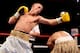 LIVERPOOL, ENGLAND - JULY 16: Paul Butler swings a right arm towards Anwar Alfadli the Super-Flyweight bout against at Echo Arena on July 16, 2011 in Liverpool, England. (Photo by Scott Heavey/Getty Images)