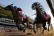 Tonalist, left, with Joel Rosario up edges out Commissioner with Javier Castellano up to win the 146th running of the Belmont Stakes horse race, Saturday, June 7, 2014, in Elmont, N.Y. (AP Photo/Matt Slocum)