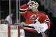 New Jersey Devils goaltender Martin Brodeur puts on his mask before playing against the Detroit Red Wings in an NHL hockey game Tuesday, March 4, 2014, in Newark, N.J. (AP Photo/Bill Kostroun)
