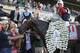 Joel Rosario poses for photos atop Tonalist after winning the 146th running of the Belmont Stakes horse race, Saturday, June 7, 2014, in Elmont, N.Y. (AP Photo/Seth Wenig)