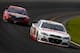 LONG POND, PA - JUNE 08: Dale Earnhardt Jr., driver of the #88 National Guard Chevrolet, leads Brad Keselowski, driver of the #2 Redds Ford, during the NASCAR Sprint Cup Series Pocono 400 at Pocono Raceway on June 8, 2014 in Long Pond, Pennsylvania. (Photo by Jeff Zelevansky/Getty Images)
