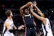 SAN ANTONIO, TX - JUNE 08: Chris Bosh #1 of the Miami Heat looks to pass as Tiago Splitter #22 and Tim Duncan #21 of the San Antonio Spurs defend during Game Two of the 2014 NBA Finals at the AT&T Center on June 8, 2014 in San Antonio, Texas. NOTE TO USER: User expressly acknowledges and agrees that, by downloading and or using this photograph, User is consenting to the terms and conditions of the Getty Images License Agreement. (Photo by Andy Lyons/Getty Images)
