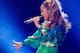 This June 4, 2014 photo released by Starpix shows singer Jennifer Lopez performing at Orchard Beach in Pelham Bay Park in the Bronx borough of New York. (AP Photo/Starpix, Kristina Bumphrey)