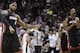 Miami Heat forward LeBron James (6) and center Chris Bosh (1) react against the San Antonio Spurs after Game 2 of the NBA basketball finals on Sunday, June 8, 2014, in San Antonio. Miami won 98-96. (AP Photo/Eric Gay)