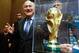SAO PAULO, BRAZIL - JUNE 05: President of FIFA Joseph Blatter poses beside the copy of the trophy of the World Cup after the press conference following the last session of the Organising Committee for the FIFA World Cup at the Grand Hyatt Hotel on June 5, 2014 in Sao Paulo, Brazil. (Photo by Alexandre Schneider/Getty Images)