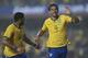 Brazil's Fred, right, celebrates with teammate Hulk after scoring against Serbia during a friendly soccer match at Morumbi stadium in Sao Paulo, Brazil, Friday, June 6, 2014. Brazil is hosting the World Cup soccer tournament that starts June 12. (AP Photo/Andre Penner)