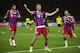 Bayern's Thomas Mueller, center, celebrates scoring his side's second goal during the German Soccer Cup Final between FC Bayern Munich and Borussia Dortmund at the Olympic Stadium in Berlin, Germany, Saturday, May 17, 2014. (AP Photo/Gero Breloer)