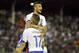 Italy's national soccer team player Lorenzo Insigne, top, celebrates with his teammate Ciro Immobile after scoring during a World Cup warm up soccer match between Italy and Fluminense at the Cidadania stadium, in Volta Redonda, Brazil, Sunday, June 8, 2014. Italy plays in group D of the 2014 soccer World Cup. (AP Photo/Antonio Calanni)