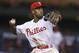 Philadelphia Phillies shortstop Jimmy Rollins looks to throw the ball during the sixth inning of a baseball game, Wednesday, Aug. 7, 2013, in Philadelphia. Chicago won 5-2. (AP Photo/Christopher Szagola)