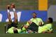 Brazil's palyers Neymar, left, Daniel Alves, center, and Fred joke around after a practice session at the Granja Comary training center in Teresopolis, Brazil, Sunday, June 1, 2014. Brazil's team will travel this Sunday for the team’s warm-up against Panama on Tuesday in preparation for the World Cup soccer tournament that starts on 12 June. (AP Photo/Leo Correa)