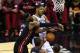 SAN ANTONIO, TX - JUNE 8: LeBron James #6 of the Miami Heat fouls Tim Duncan #21 of the San Antonio Spurs in Game Two of the 2014 NBA Finals at the AT&T Center on June 8, 2014 in San Antonio, Texas. NOTE TO USER: User expressly acknowledges and agrees that, by downloading and/or using this photograph, user is consenting to the terms and conditions of the Getty Images License Agreement. (Photo by Chris Covatta/Getty Images)